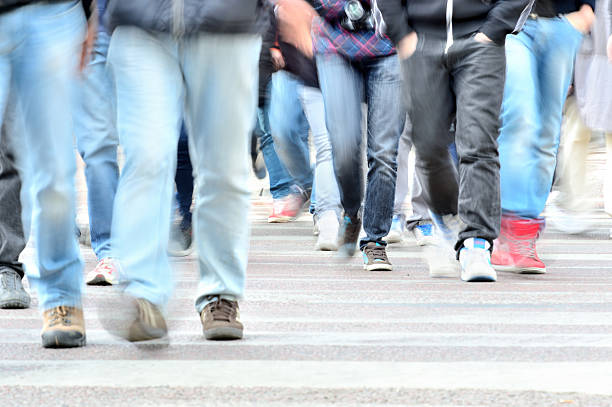istock Crowd crossing street, motion blur 495748165
