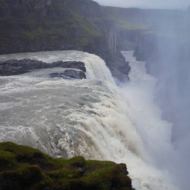 Beautiful vibrant landscape picture of famous Icelandic Waterfall in Iceland