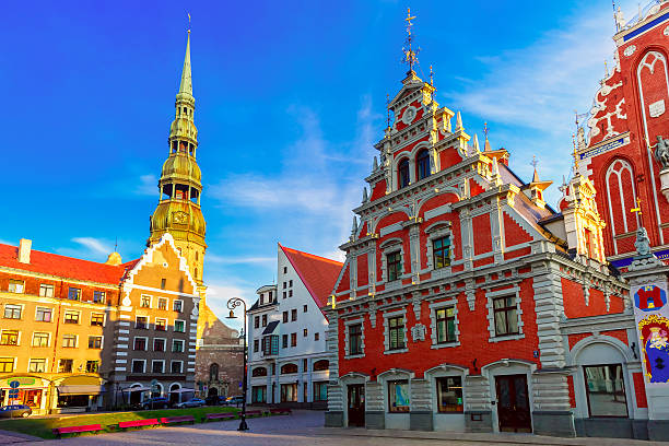 City Hall Square in the Old Town of Riga, Latvia City Hall Square with House of the Blackheads and Saint Peter church in Old Town of Riga in the evening, Latvia latvia stock pictures, royalty-free photos & images