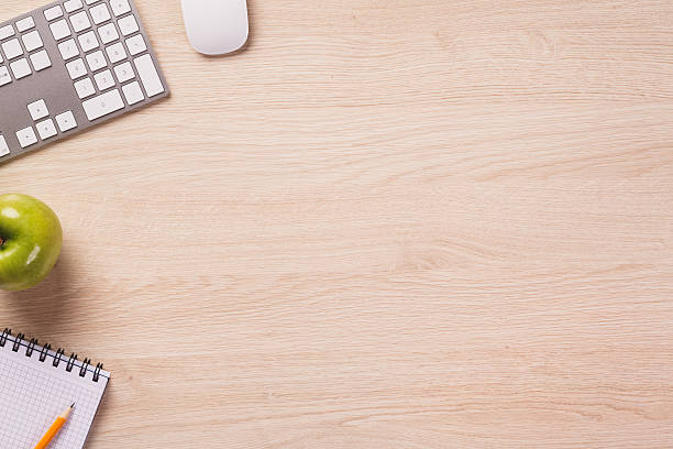 istock Top of desk with empty space and office equipment. 495753736