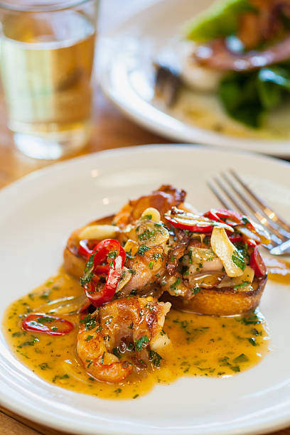istock pancetta-wrapped white shrimp with chili and garlic sauce 495754262