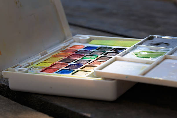 istock Paint-box on the wooden table. 495754878