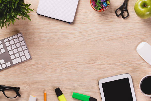 istock Top of desk with empty space and office equipment. 495756178