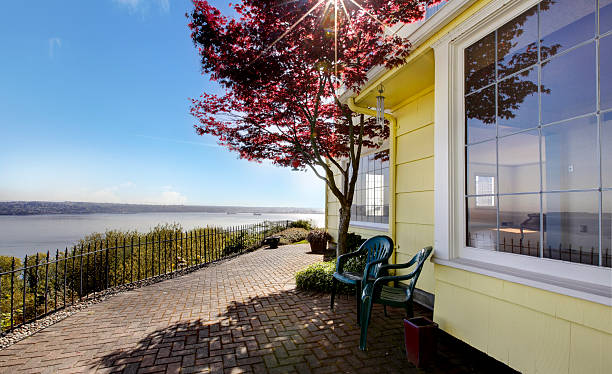 istock House with maple and amazing water view. 495756537
