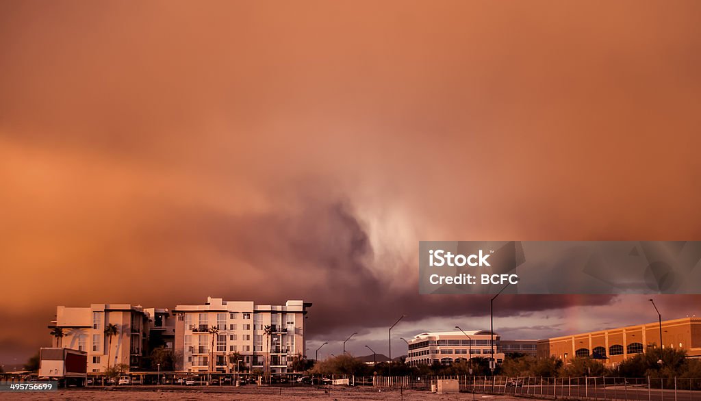 Extreme weather system Haboob dust storm Phoenix,AZ Extreme weather system Haboob dust storm over Scottsdale Phoenix,AZ at sunset causing beautiful glowing red sky and rainbow effect. Haboob Stock Photo