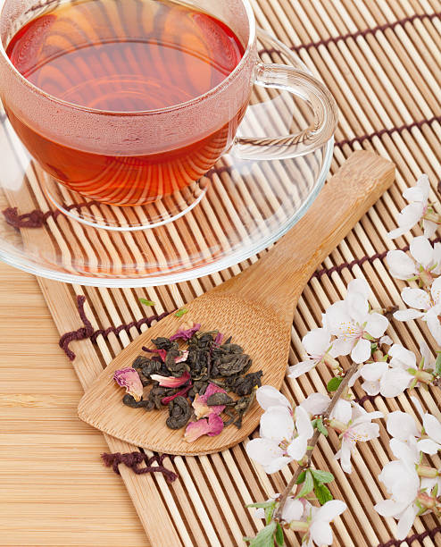 istock Japanese green tea and sakura branch 495756733