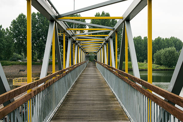 istock metal bridge crossing the river 495757029