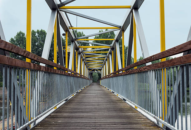istock metal bridge crossing the river 495757031