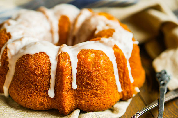 istock Bundt cake with white glaze on rustic background 495757099