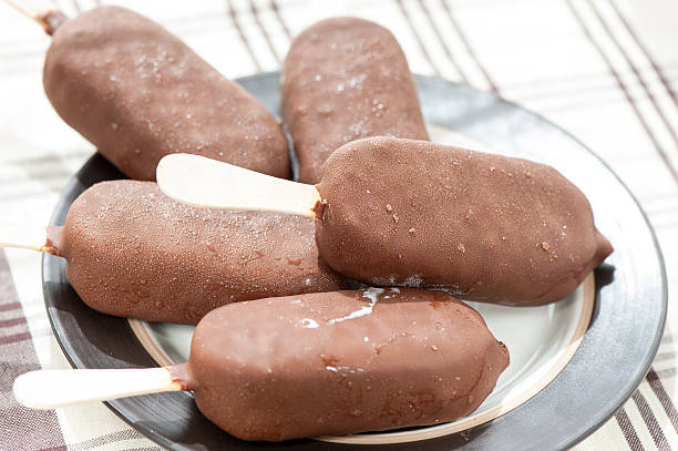 istock Eskimo ice-cream. White vanilla glazed with chocolate. Closeup. 495757673