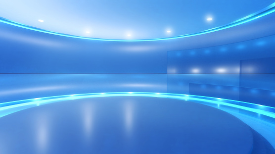 Television studio background for virtual set: empty circular space with blue walls, round elevated stage surrounded by shining lights and reflecting surfaces. Modern design and backdrop for media, broadcasting and entertainment industry. Digitally generated image, copy space.