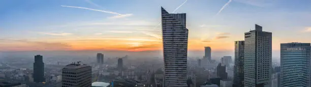 Panorama of foggy sundown over Warsaw city, Poland