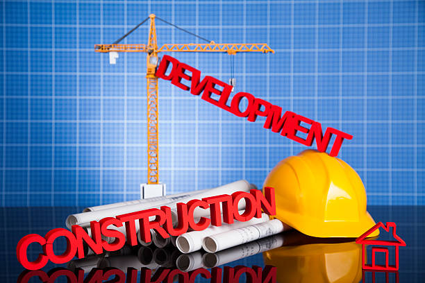 istock Crane, Safety helmet, Blueprints and construction site 495759538