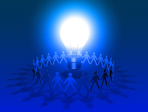 istock blue big lightbulb shining surrounded by group of people 495760403