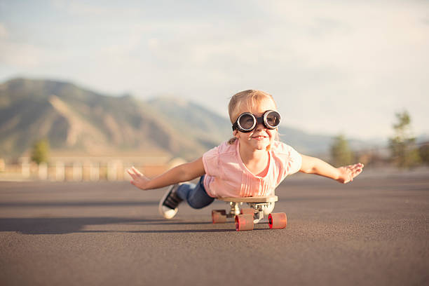 istock Young Girl Imagines Flying On Skateboard 495760806