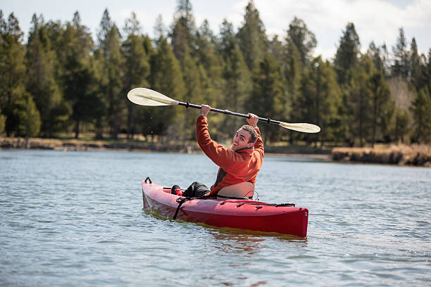 istock Young adult kayaking on river 495761062