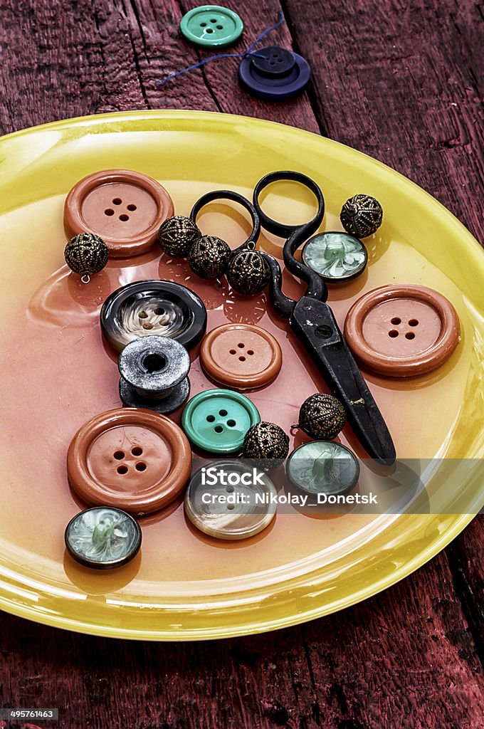 buttons and zipper different buttons and zipper on the background of sewing tool Art Stock Photo