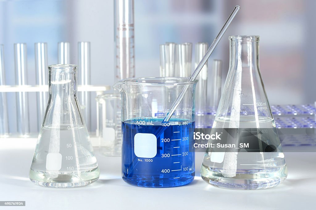 Laboratory Glass on Table Laboratory beakers, flasks, and test tubes on lab table 2015 Stock Photo