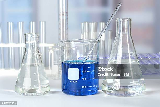 Laboratory Glass On Table Stock Photo - Download Image Now - 2015, Beaker, Blue