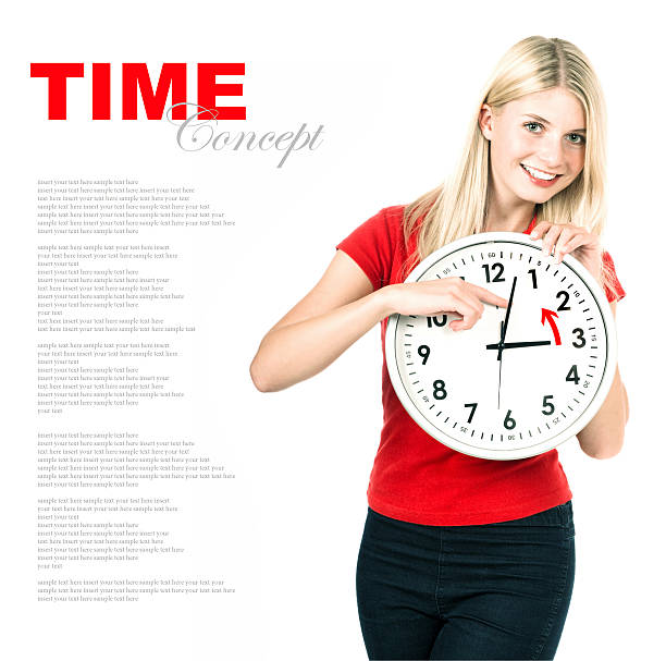 Young woman holding a clock. Time management concept