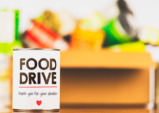 пожалуйста, поддержку наших продуктов drive. консервы drive - food canned food drive motivation стоковые фото и изображения