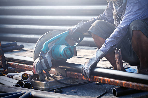 istock cutting steel with machine for cutting steel by worker 495763849