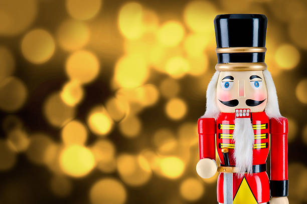 istock Soldier nutcracker statue standing in front of Christmas lights 495771776
