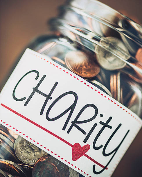 istock Charity money collection jar with American currency 495772448