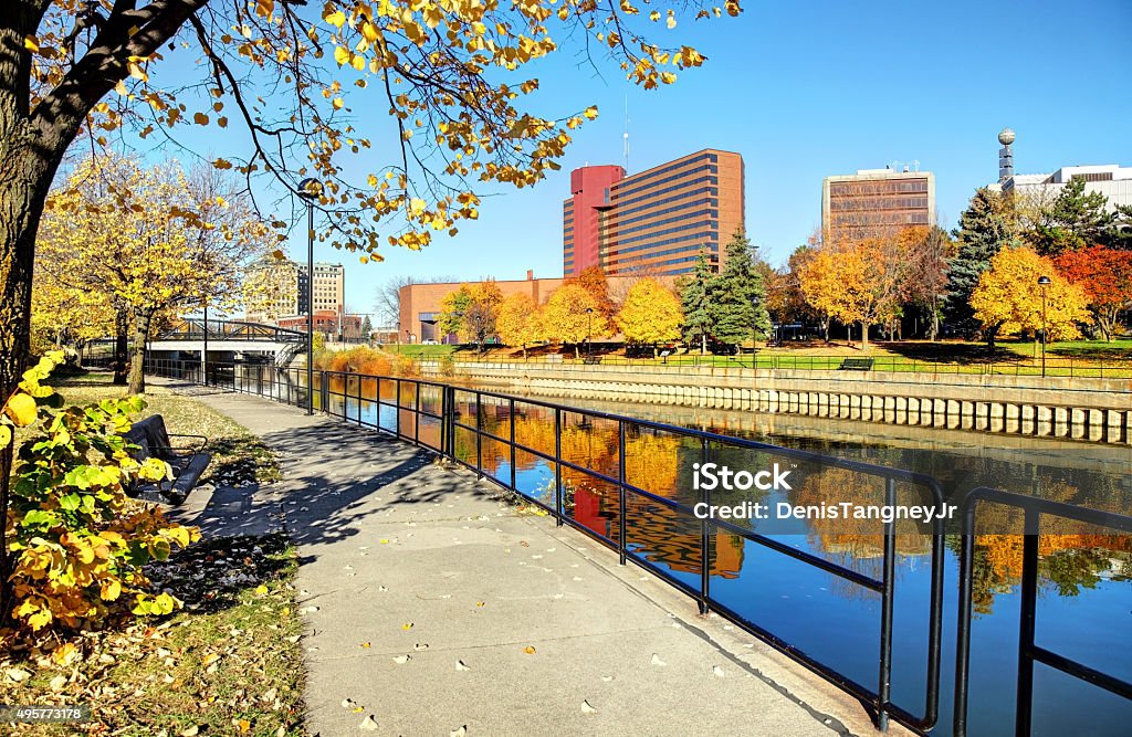 Flint Michigan Autumn colors along the Flint River in downtown Flint, Michigan Michigan Stock Photo