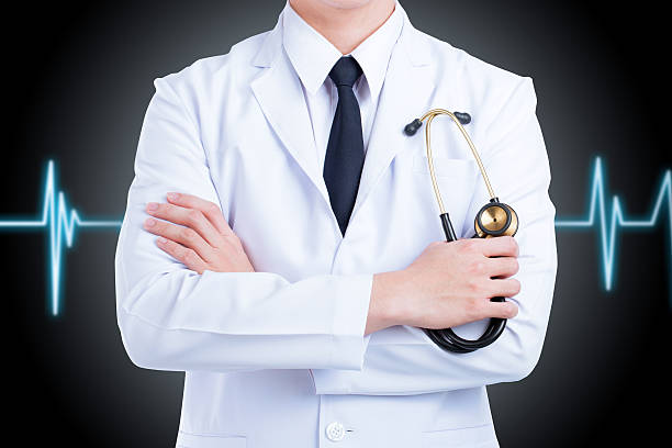 istock Doctor stand fold one's arms isolated on black background. 495774174