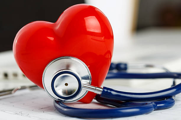 istock Medical stethoscope head and red toy heart 495774400