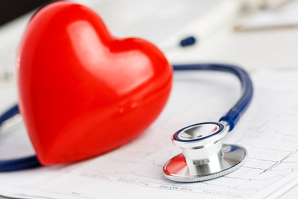 istock Medical stethoscope head and red toy heart 495774446
