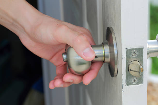 istock man's hand open the white door 495778582