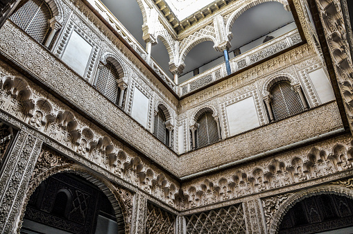 Seville, Spain - August 11, 2015: Architecture of the Alcazar, UNESCO World Heritage Site. The photo was taken of a building facade during the day and contains no people.