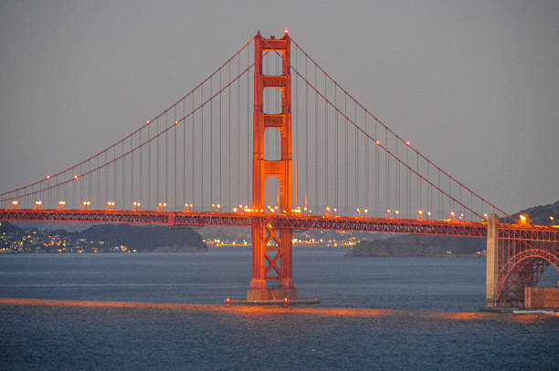 мост золотые ворота-закате - golden gate bridge car san francisco bay san francisco county стоковые фото и изображения