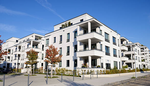 istock Row of white apartment houses 495782014