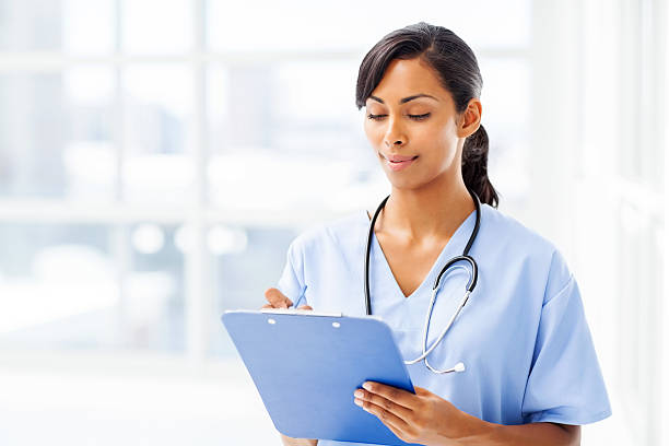 istock Doctor Writing On Clipboard In Hospital 495782243