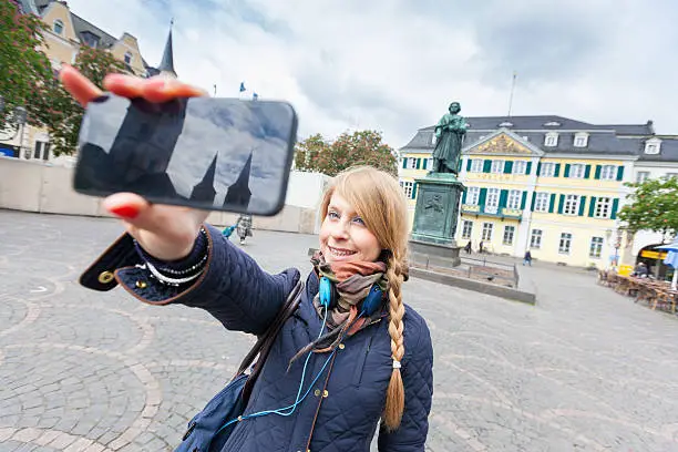 German Girl Taking Selfie in Bonn Main Square