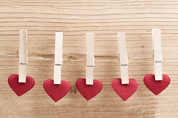 istock Red fabric heart hanging on the clothesline 495784046