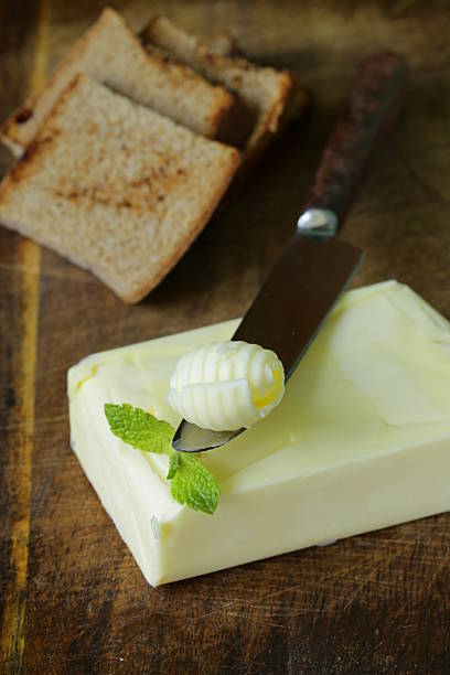istock fresh yellow butter served on a wooden board 495785165