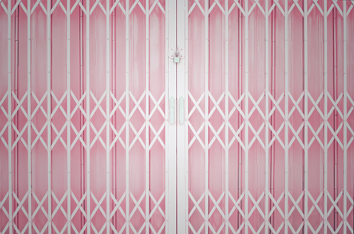 Pink metal grille sliding door with pad lock and aluminium handle