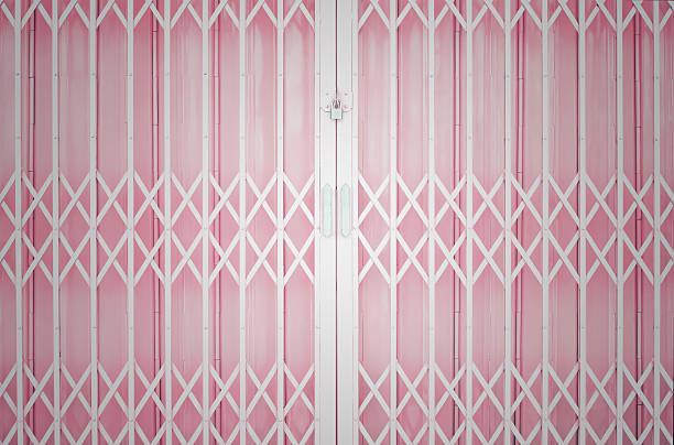 Pink metal grille sliding door stock photo