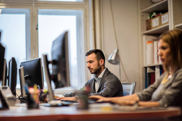 istock Young businessman working on computer in the office. 495785778