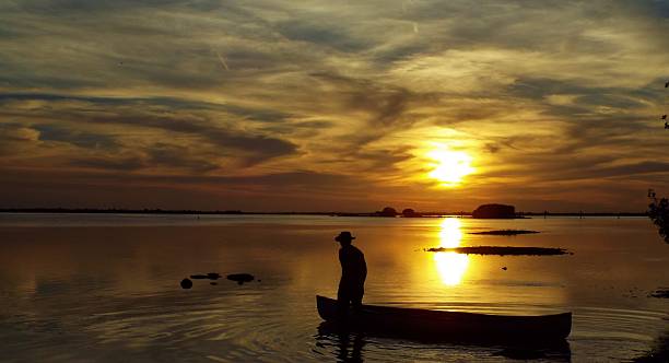 istock Sunset Canoe Silhouette  Pineland Florida 495786673