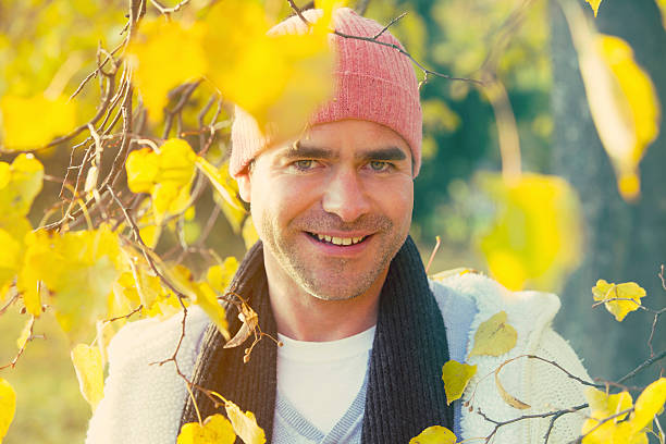 istock portrait of a man next to a tree 495798342