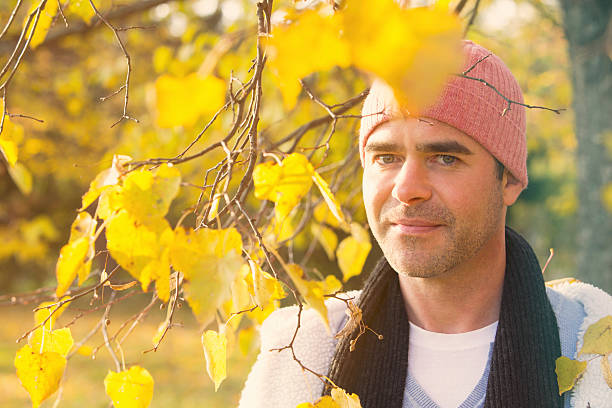 istock portrait of a man next to a tree 495798388