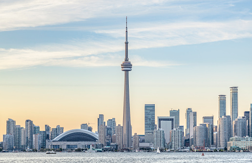 Toronto, Ontario, Canada - November 10, 2023:  The Toronto city skyline during the early morning hours.  This is the view from Front Street downtown facing west towards the CN Tower.