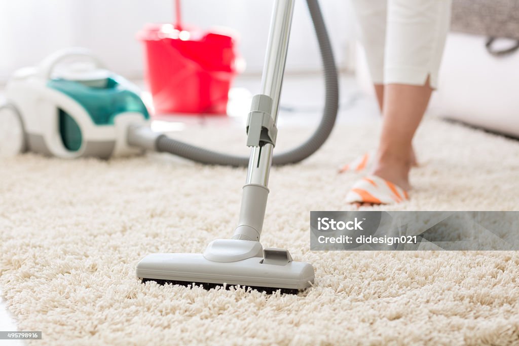 Suction carpet Suction grey carpet cleaning with vacuum cleaner Carpet - Decor Stock Photo