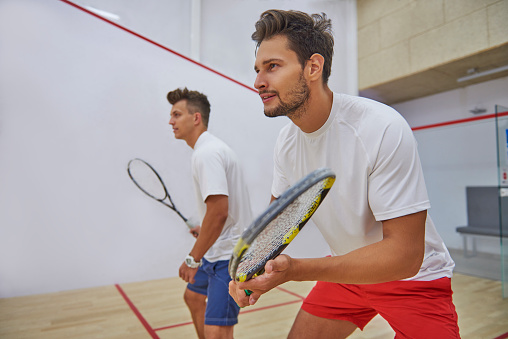 Very pensive men on the squash court