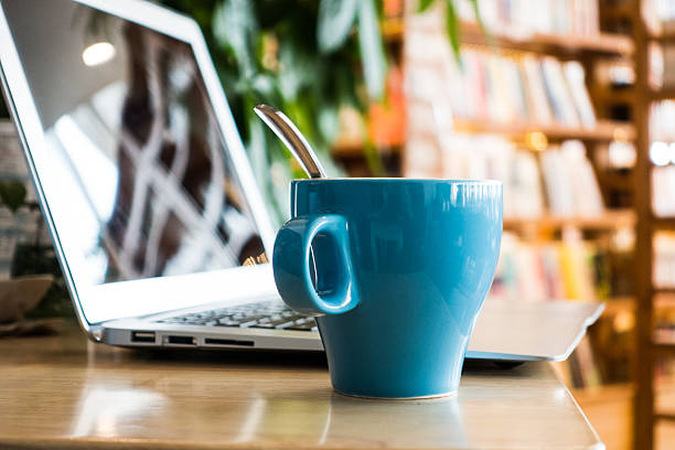 istock Laptop and a cup of coffee on office desk 495799432
